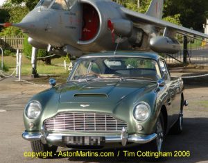 Aston Martin DB4 Vantage, photographed at Brooklands during the 2006 AMOC Autumn Concours. In the background is the P1127, prototype for the Harrier Jump Jet